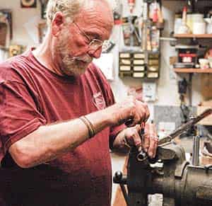 John Bengel installing gun sights.