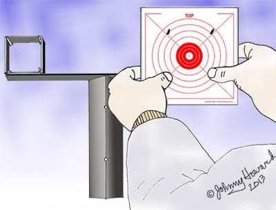 Aligning the target to the nails on target holder